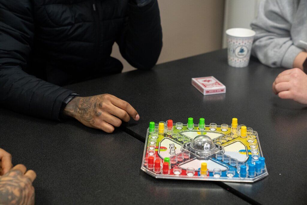 Youth playing board game