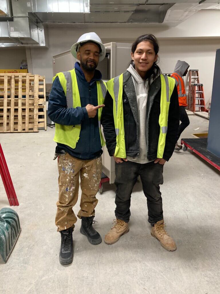 Youth and supervisor at job site